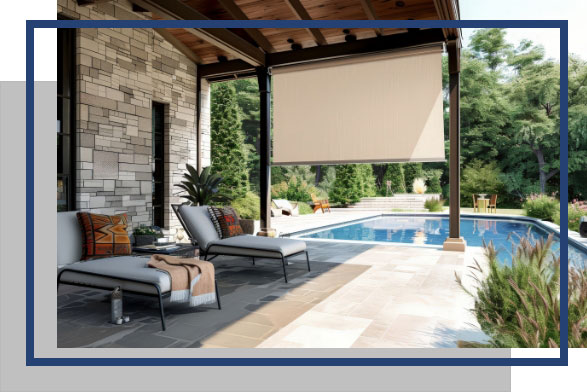 Cable guided sun shade on back patio with a pool in the backyard.